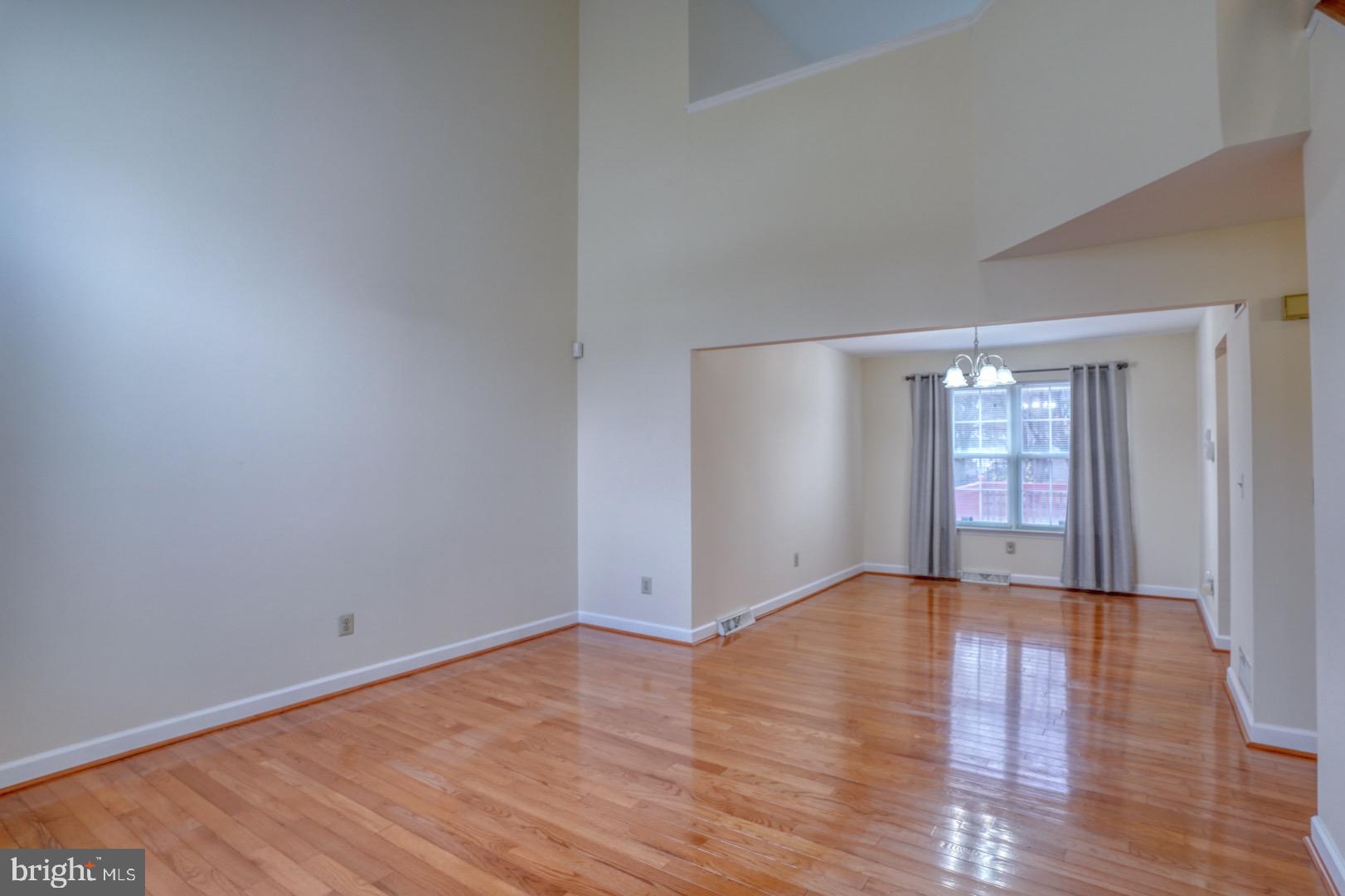 22 Arbor Drive Dover, DE 19904 - Photo 10 of 52 a view of an empty room with wooden floor and window