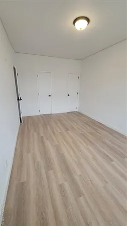 wooden floor in white room