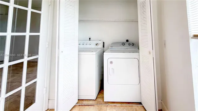 a kitchen with a sink and a refrigerator