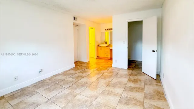 a view of a bathroom with a sink and a mirror