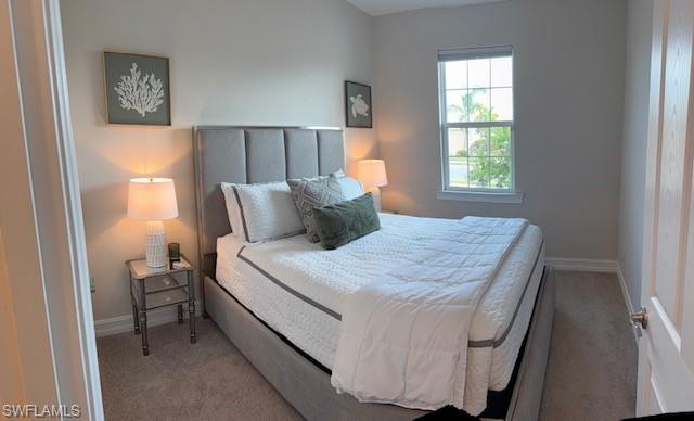 847 Enbrook Loop Naples, FL 34114 - Photo 12 of 17 a bedroom with a bed and a window