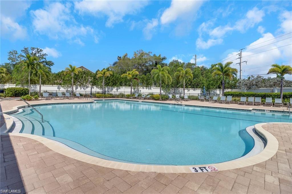 847 Enbrook Loop Naples, FL 34114 - Photo 13 of 17 a view of a swimming pool in a back yard