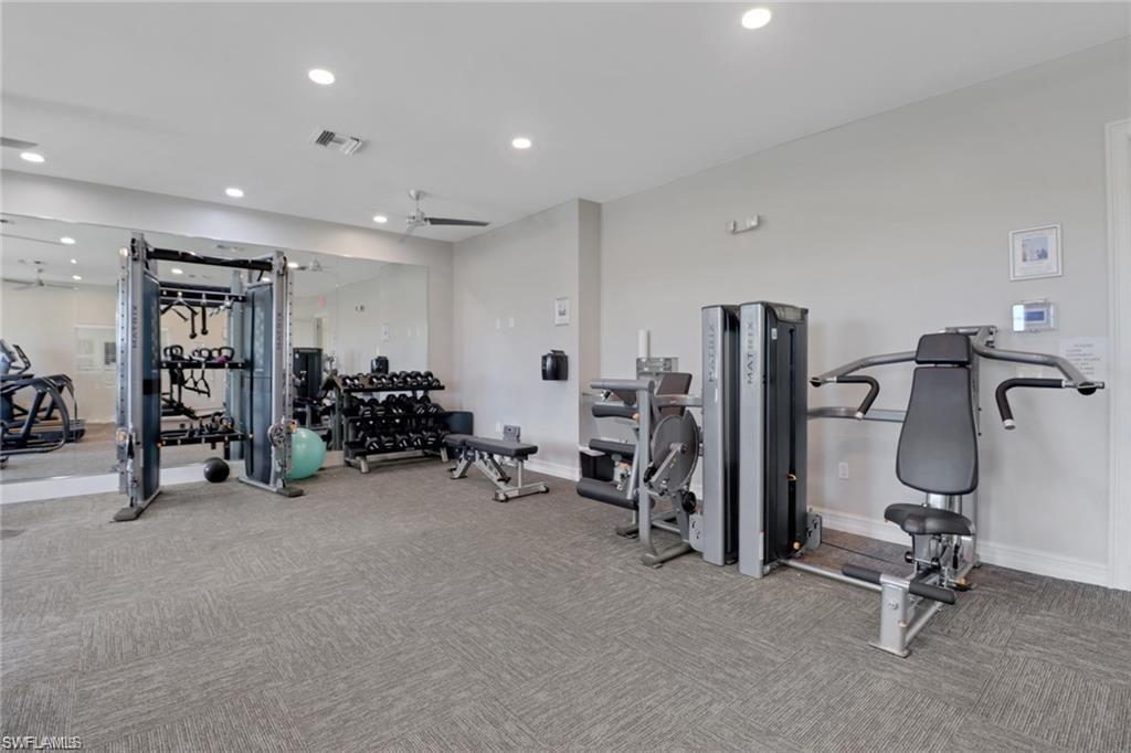 847 Enbrook Loop Naples, FL 34114 - Photo 16 of 17 a view of a room with gym equipment
