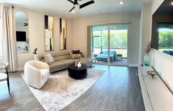a living room with furniture and a large window
