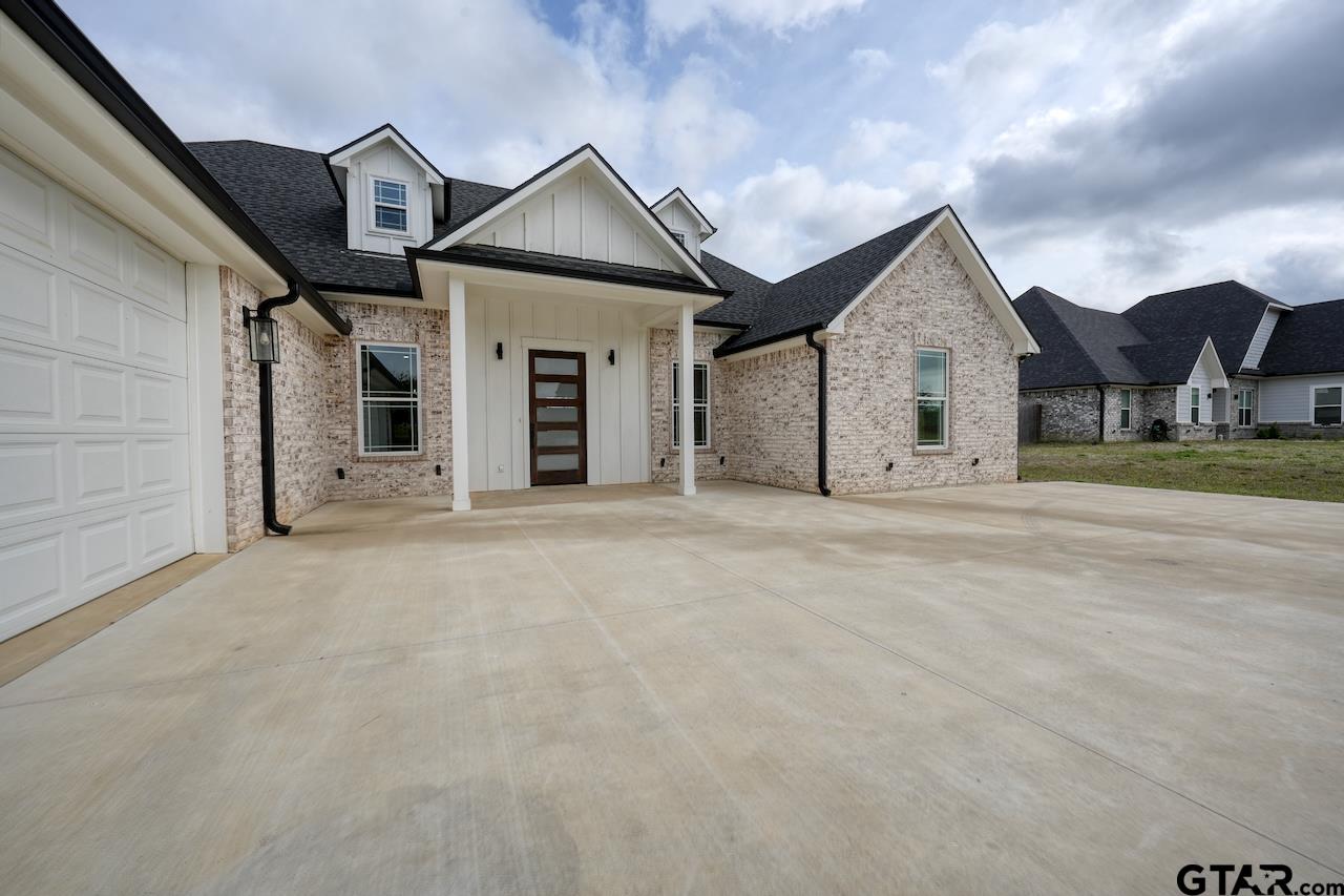 19383 Ridge Point Circle Lindale, TX 75771 - Photo 2 of 48 a view of a house with a yard