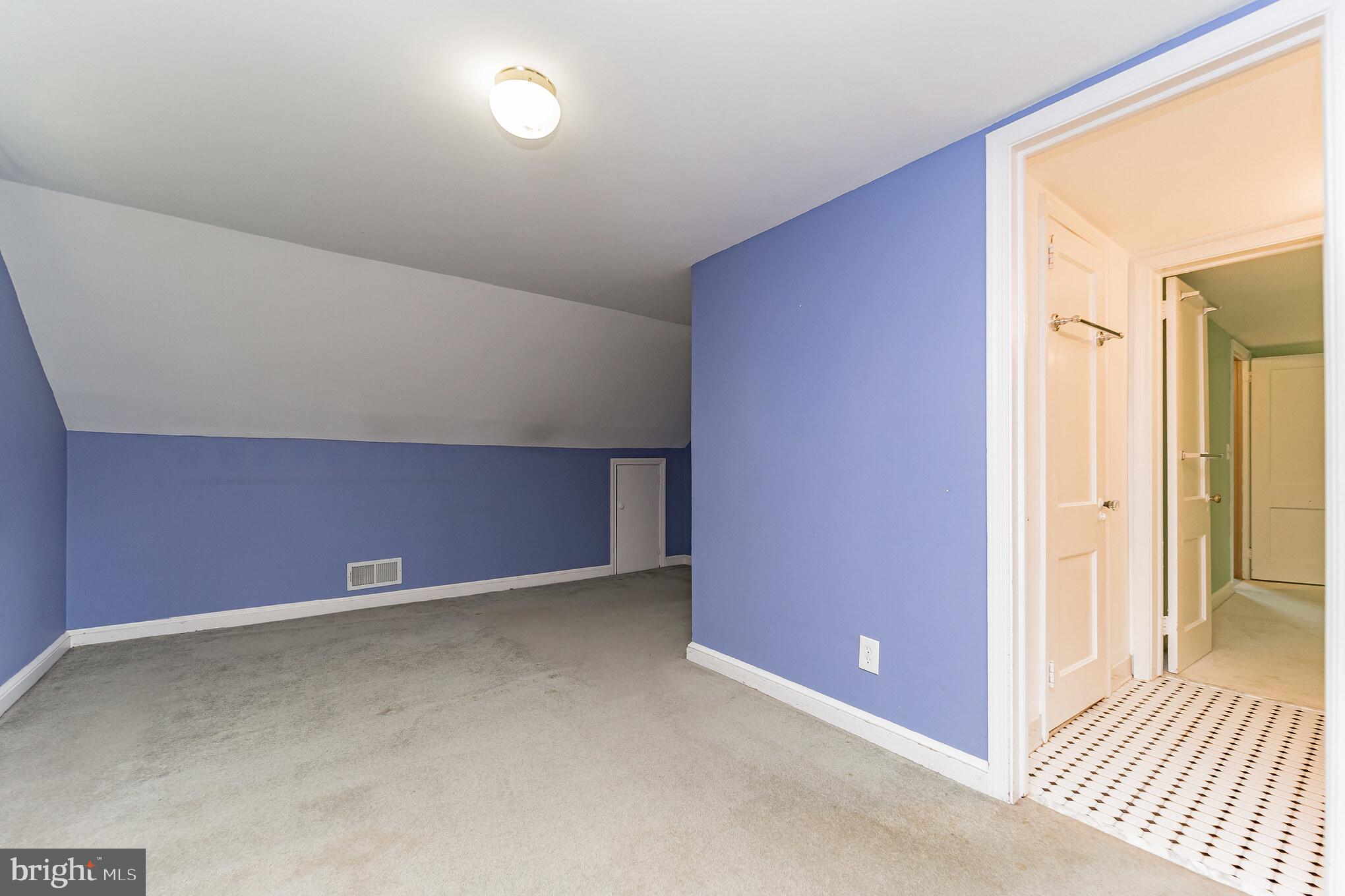 403 Belton Road Silver Spring, MD 20901 - Photo 16 of 22 an empty room with wooden floor and windows