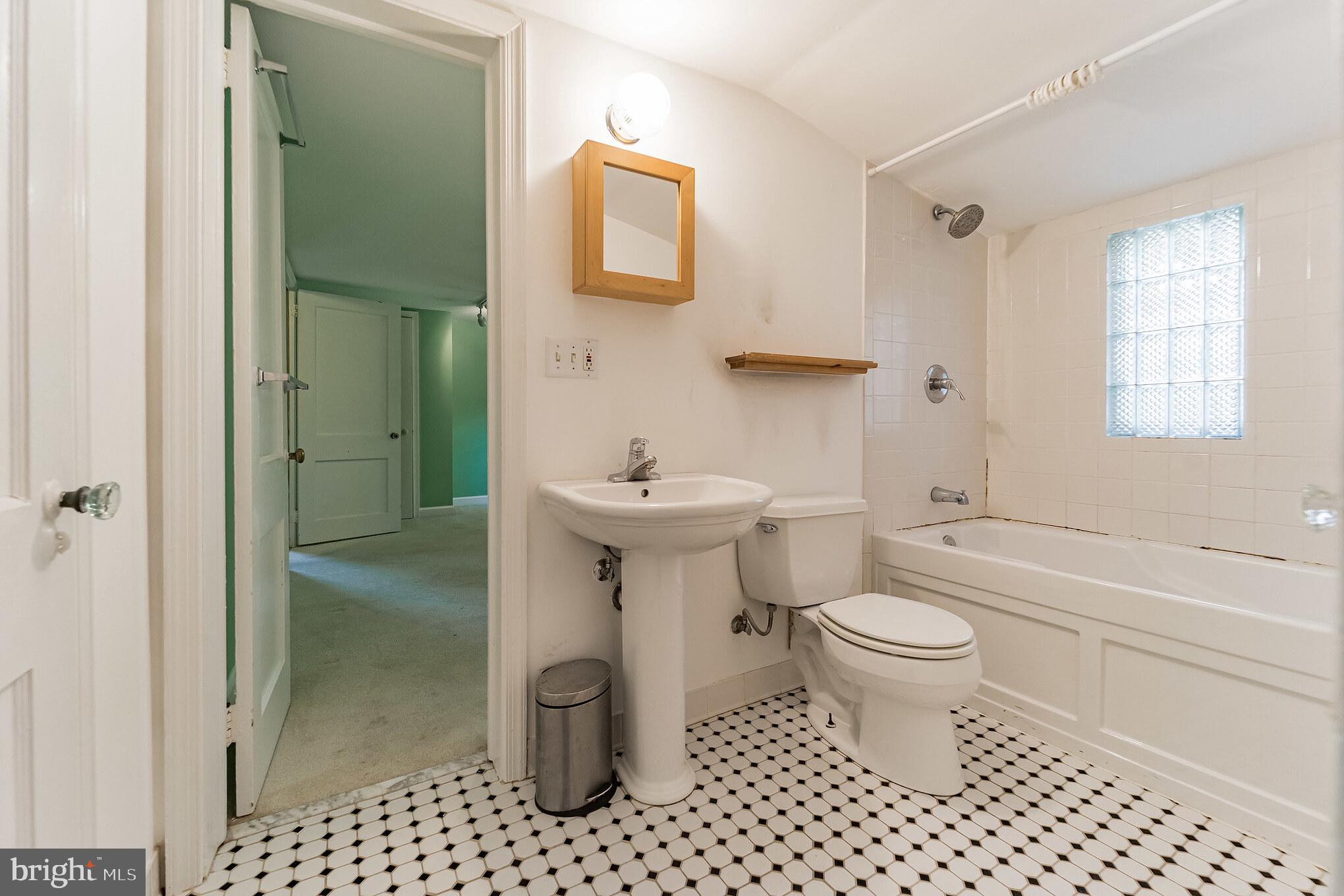 403 Belton Road Silver Spring, MD 20901 - Photo 17 of 22 a bathroom with a sink toilet and shower