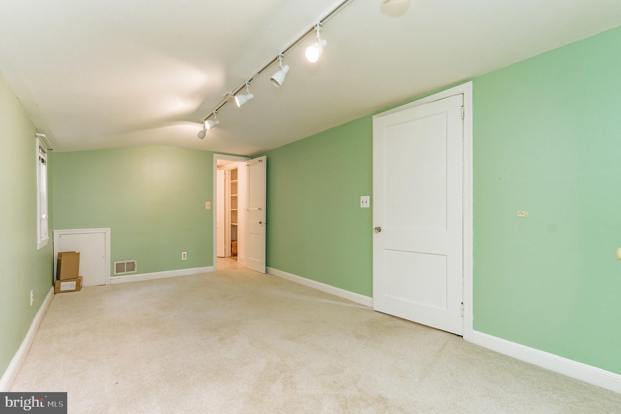 403 Belton Road Silver Spring, MD 20901 - Photo 19 of 22 a view of an empty room with a fireplace