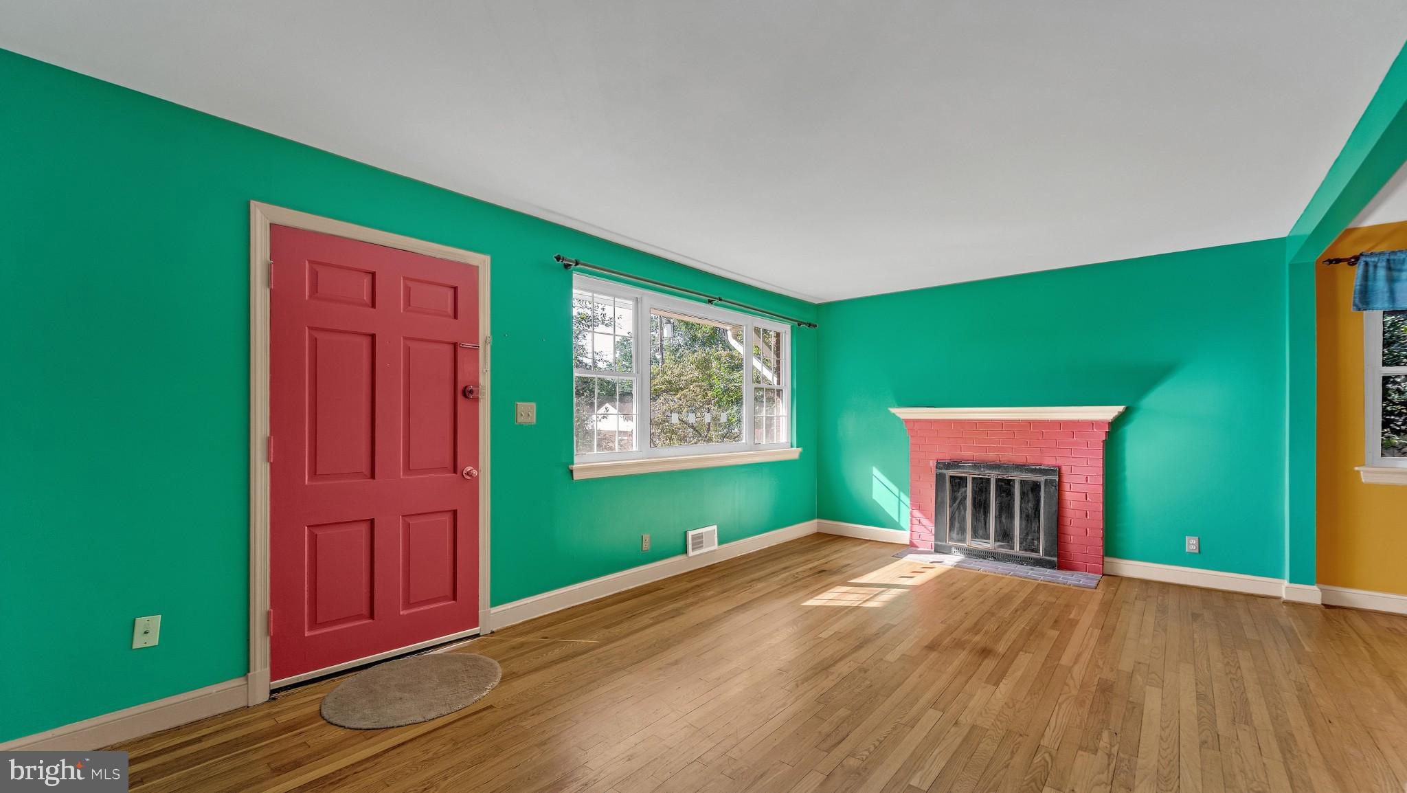 403 Belton Road Silver Spring, MD 20901 - Photo 2 of 22 a view of empty room with window and fireplace