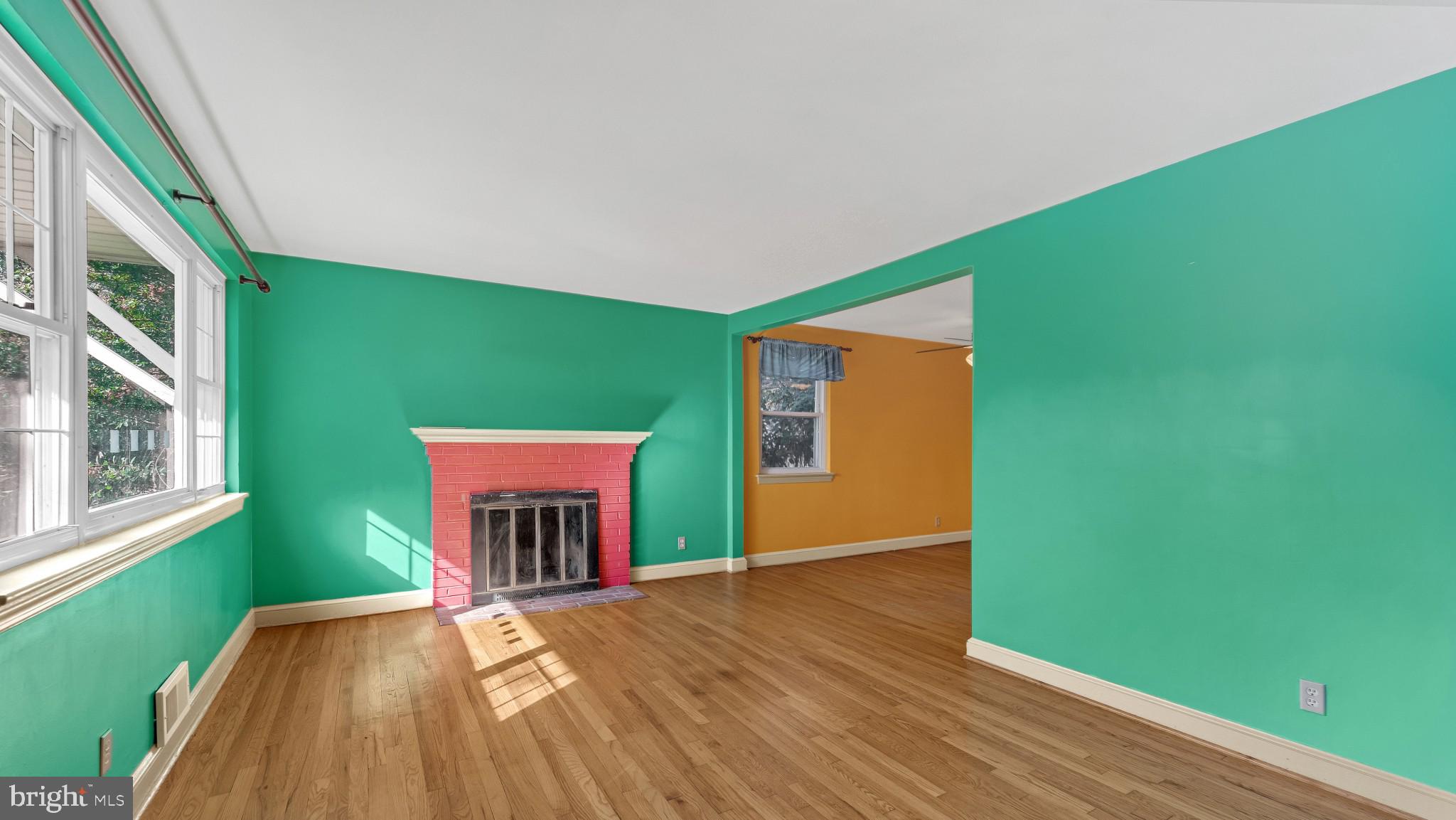 403 Belton Road Silver Spring, MD 20901 - Photo 4 of 22 a view of a room with wooden floor and a window