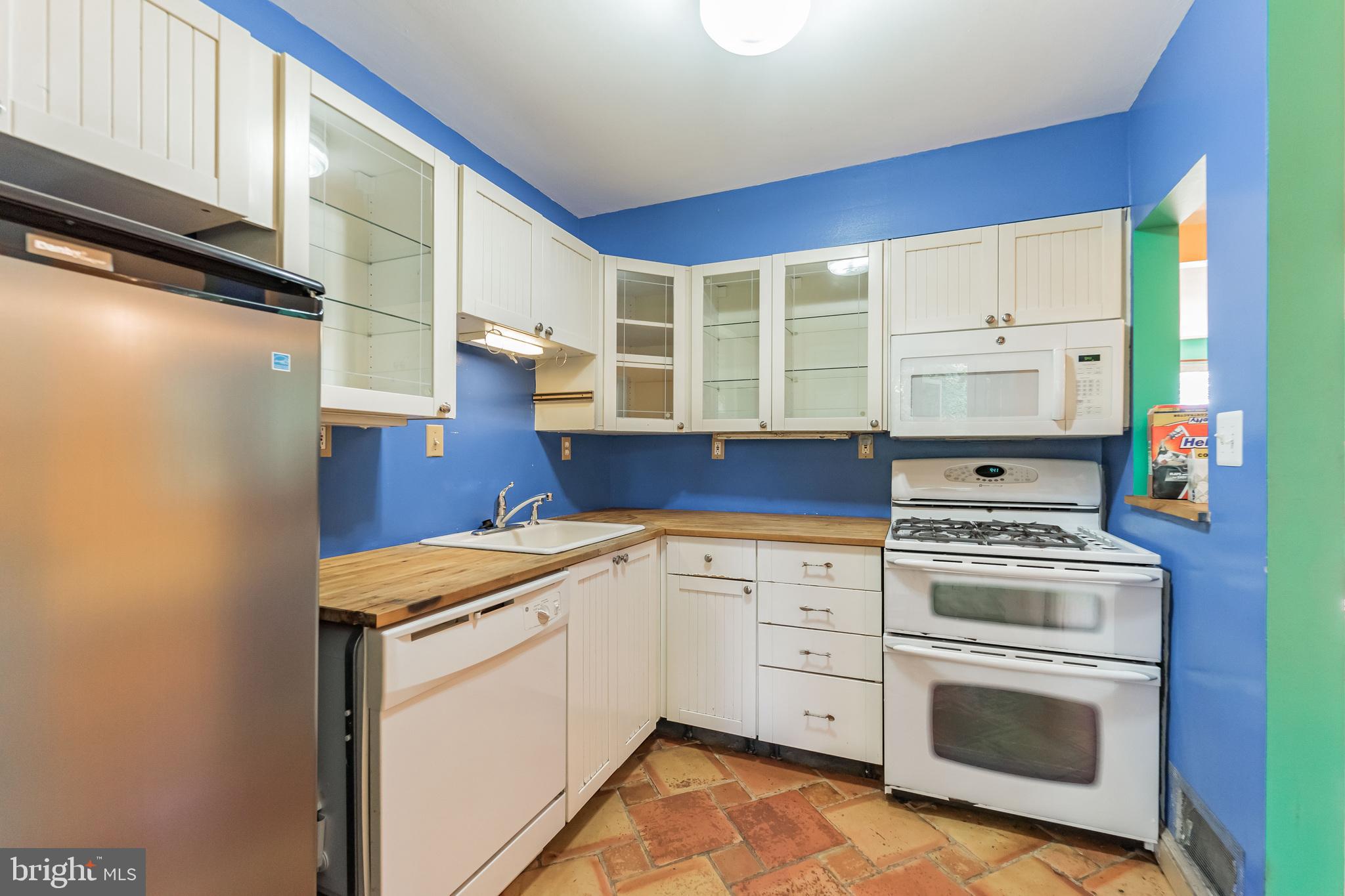 403 Belton Road Silver Spring, MD 20901 - Photo 7 of 22 a kitchen with a stove oven and sink