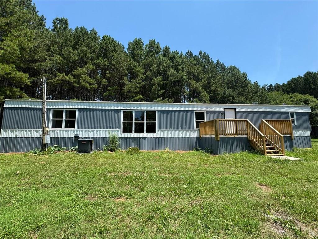 a house view with a sitting space and garden