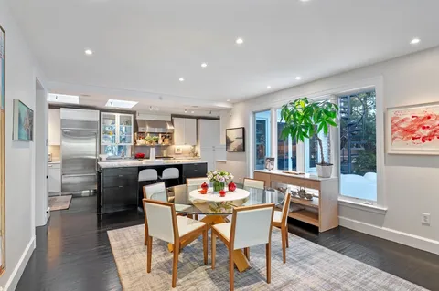 a kitchen with a stove a refrigerator and a sink