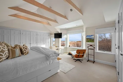 a bedroom with furniture and a couch