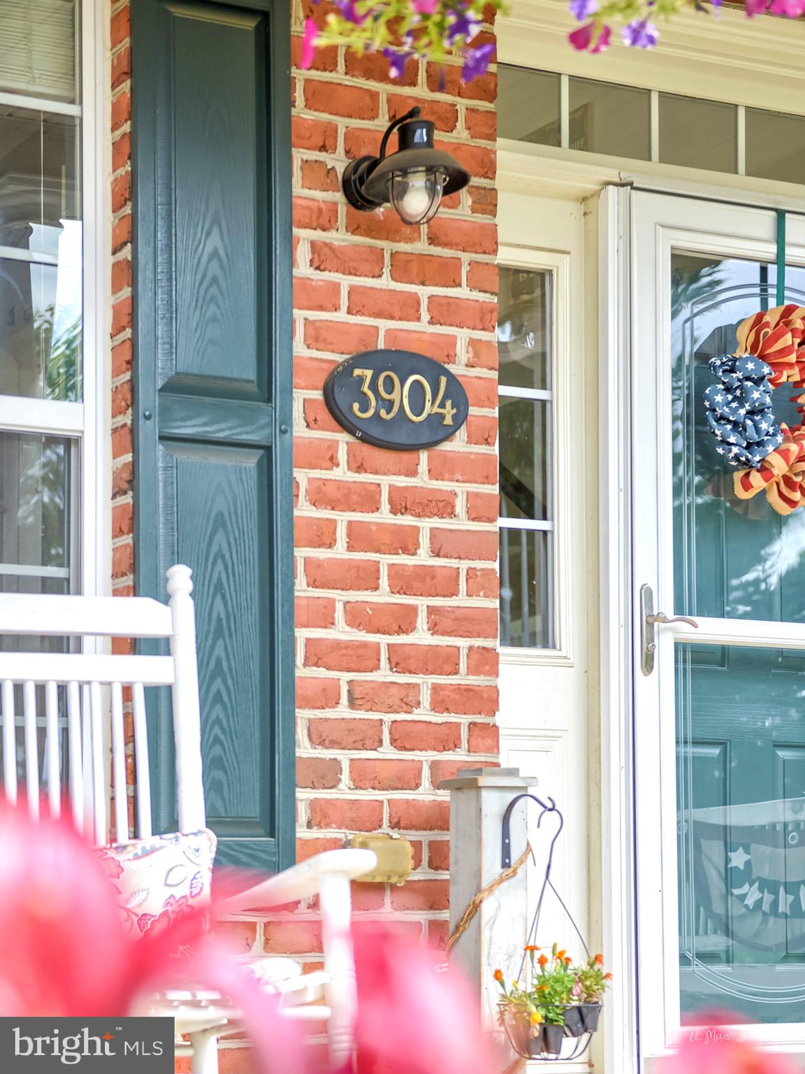 3904 Calico Circle Point of Rocks, MD 21777 - Photo 2 of 52 a front view of a house with an entrance and flowers