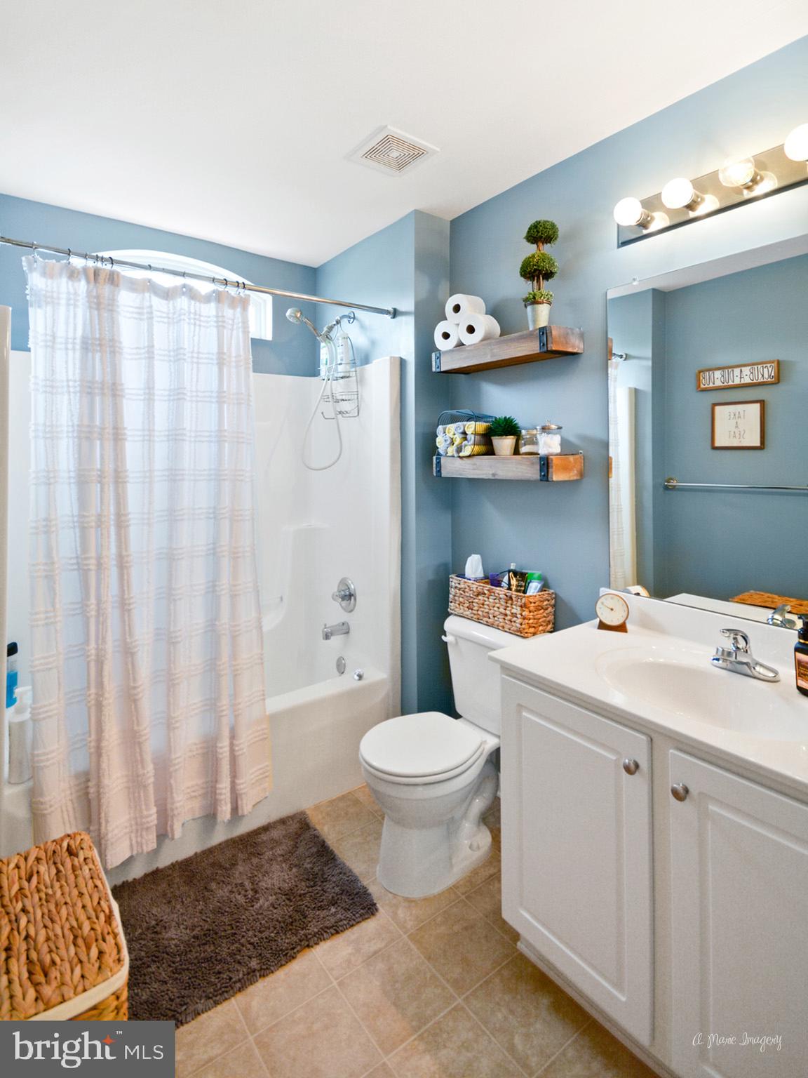 3904 Calico Circle Point of Rocks, MD 21777 - Photo 38 of 52 a bathroom with a sink toilet and shower