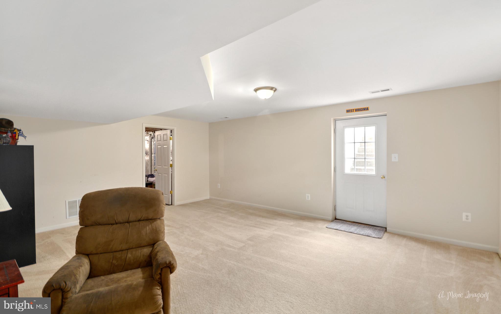 3904 Calico Circle Point of Rocks, MD 21777 - Photo 41 of 52 a living room with a couch and a window