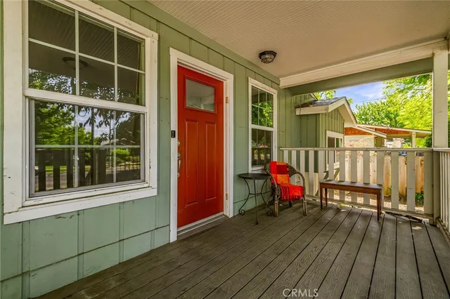 a large white kitchen with granite countertop a sink and stainless steel appliances