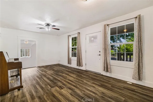 a kitchen with stainless steel appliances white cabinets and a refrigerator
