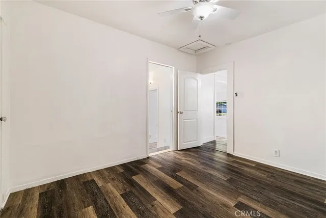 a backyard of a house with plants and trees