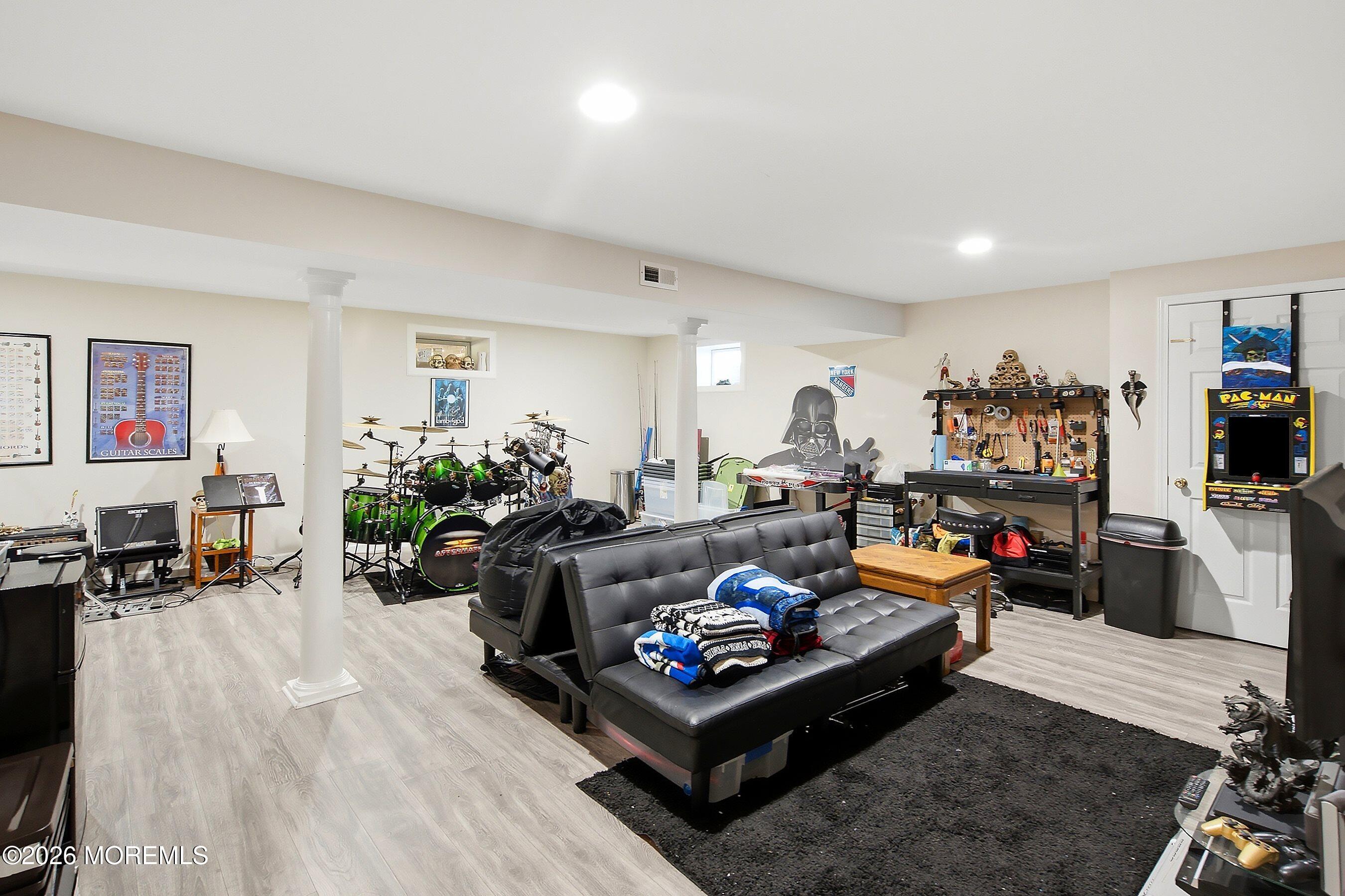 935 Bethel Church Road Jackson, NJ 08527 - Photo 25 of 32 a living room with furniture and a flat screen tv