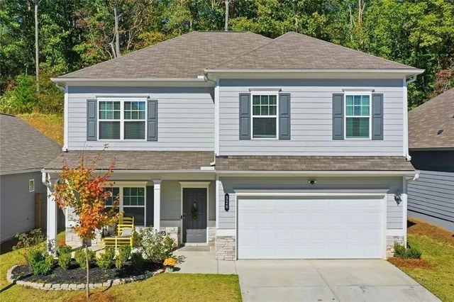 a front view of a house with garden