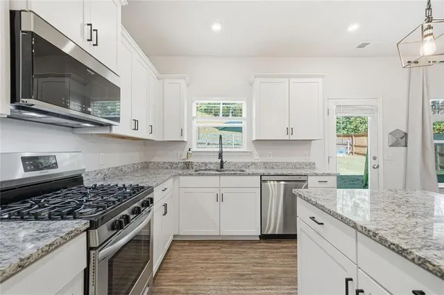 a living room with furniture fireplace and flat screen tv