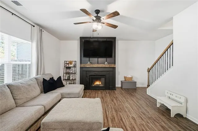 a living room with furniture and a large window