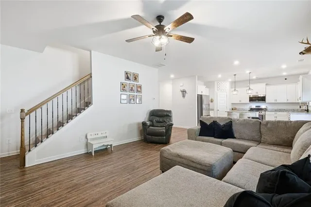 a spacious bedroom with a bed and a couch