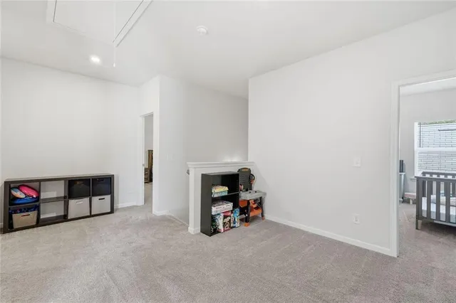 a spacious bathroom with a double vanity sink and a mirror