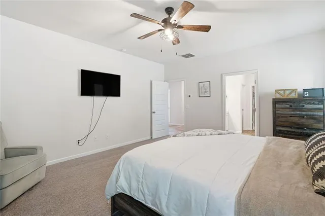 a living room with furniture and a book shelf