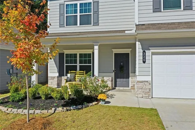 a view of an entryway with wooden floor