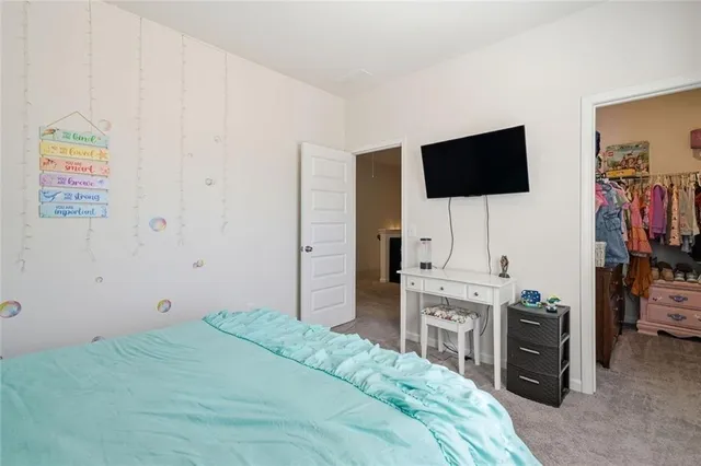 a view of a chair and table on the patio