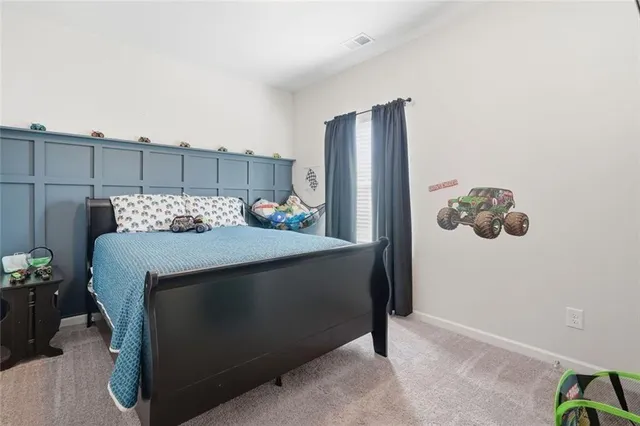 a view of a house with a yard patio and a slide