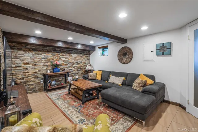 a living room with fireplace furniture and a wooden floor
