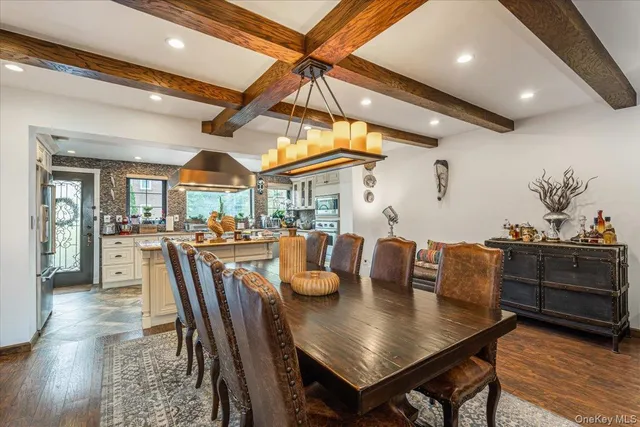 a dining room with furniture and wooden floor