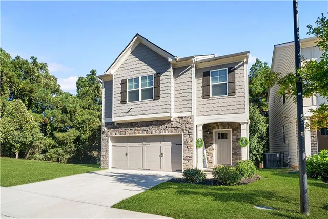 front view of a house with a yard