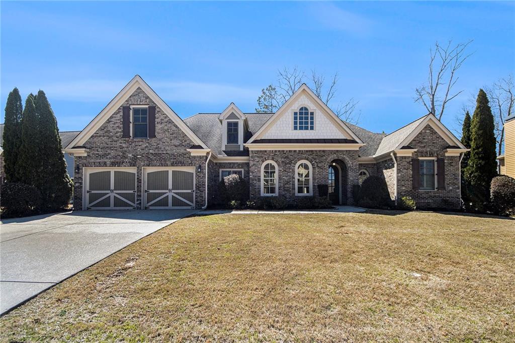 a front view of a house with yard