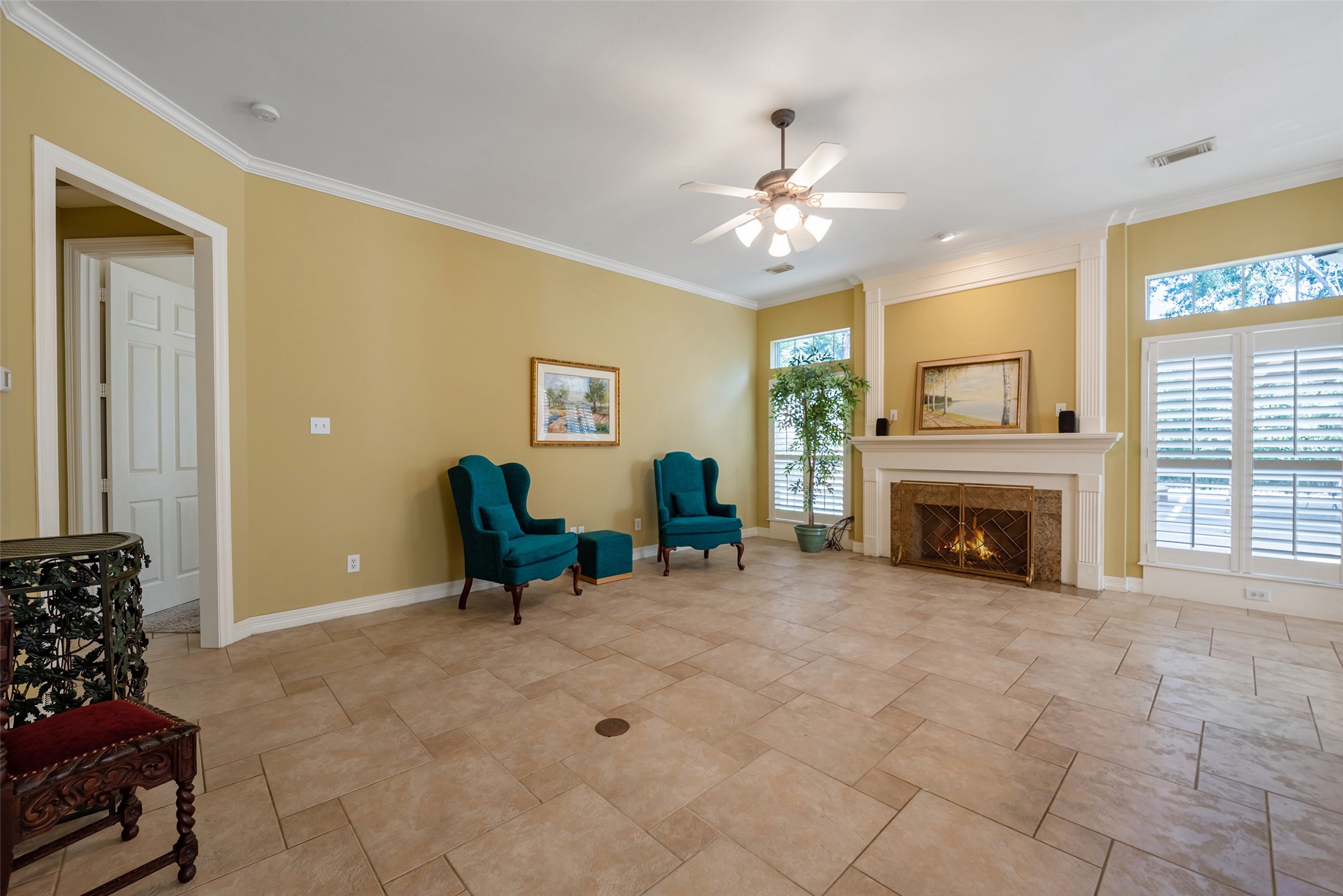15306 Beecham Drive Houston, TX 77068 - Photo 9 of 48 The focal point of this room is the beautiful fireplace encased by windows overlooking the backyard.