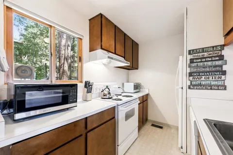 a kitchen with a stove and a microwave