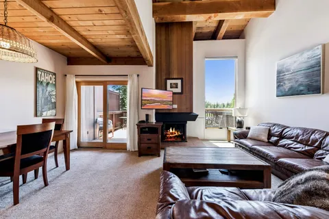 a living room with furniture and a table