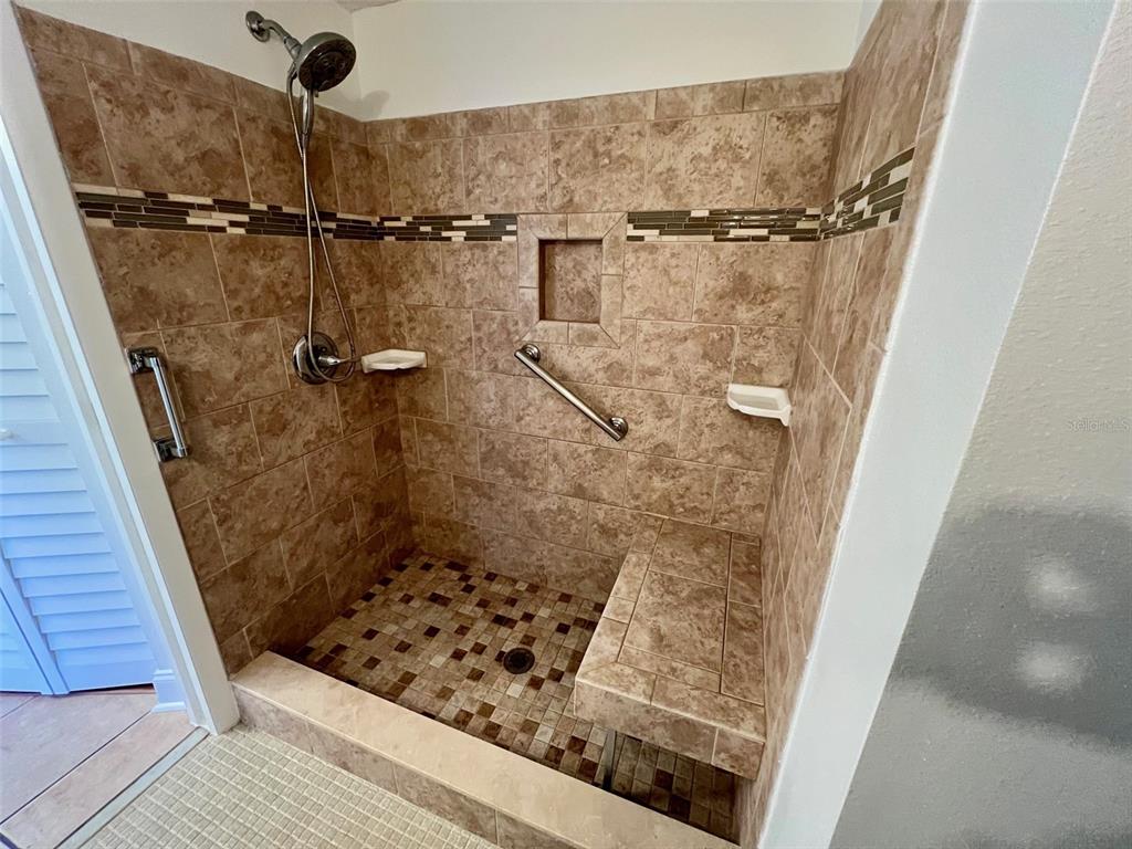 387 South McMullen Booth Road, Unit 13 Clearwater, FL 33759 - Photo 15 of 30 a bathroom with a shower