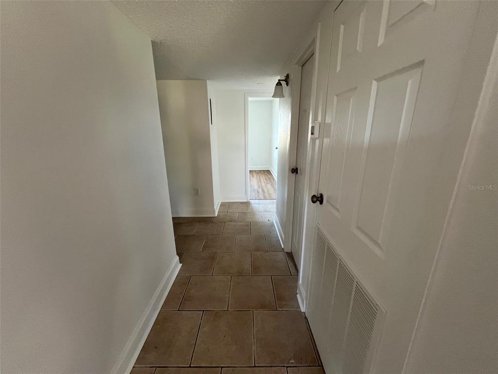 387 South McMullen Booth Road, Unit 13 Clearwater, FL 33759 - Photo 18 of 30 a view of a bathroom from a hallway