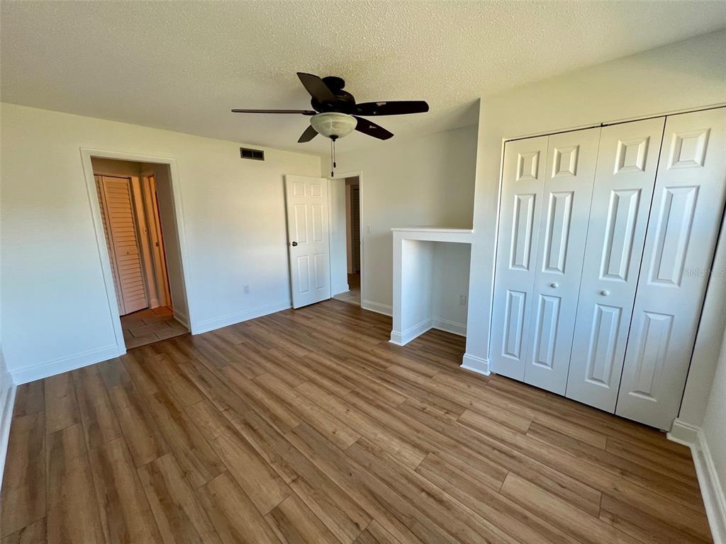 387 South McMullen Booth Road, Unit 13 Clearwater, FL 33759 - Photo 20 of 30 a view of a room with wooden floor