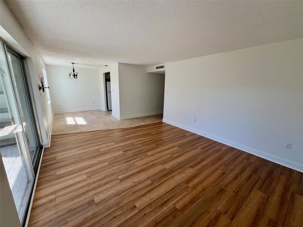 387 South McMullen Booth Road, Unit 13 Clearwater, FL 33759 - Photo 6 of 30 a view of a livingroom with wooden floor and stairs