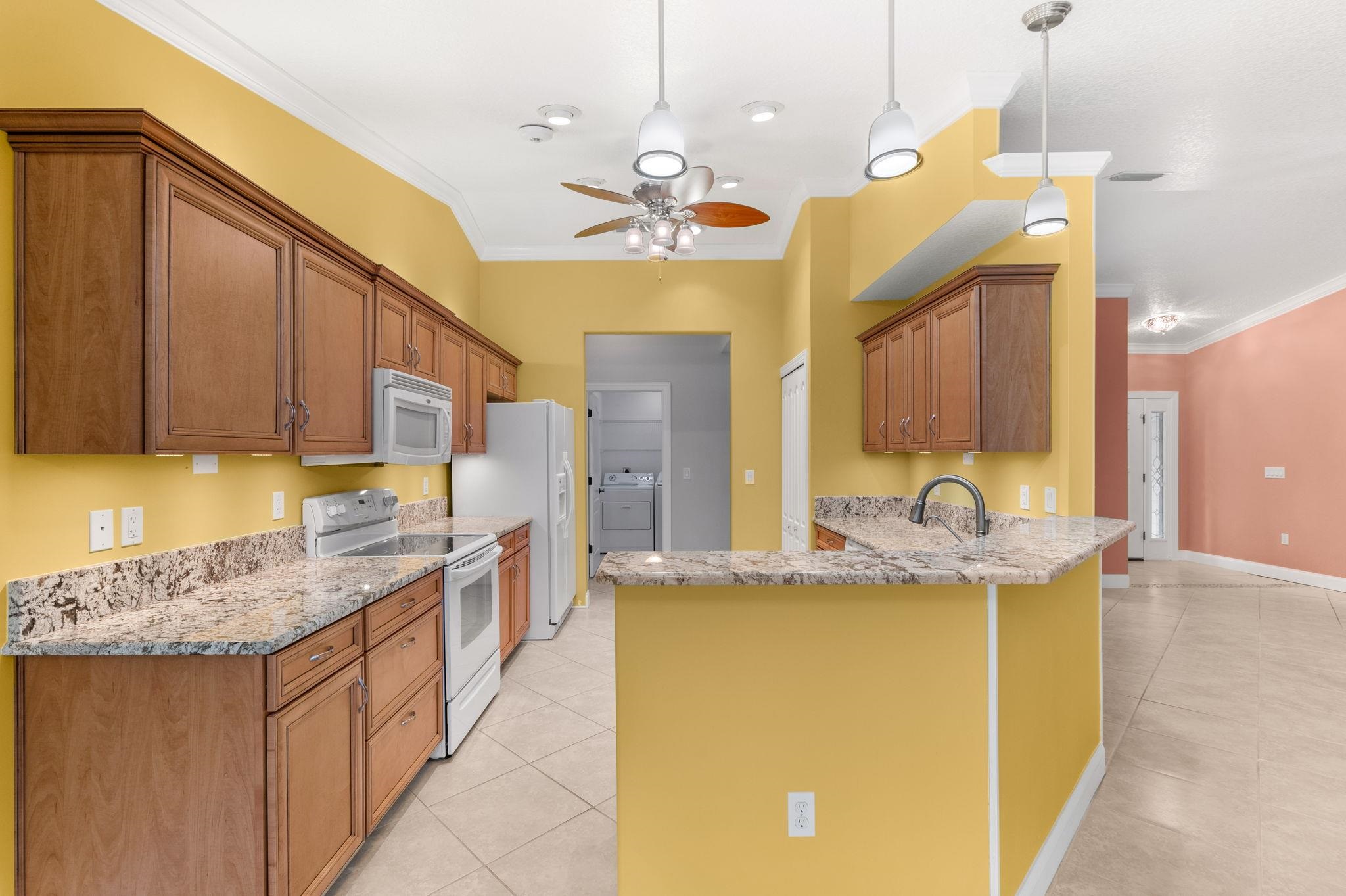 3489 Kings Road St. Augustine, FL 32086 - Photo 21 of 76 a bathroom with a granite countertop sink a vanity and mirror