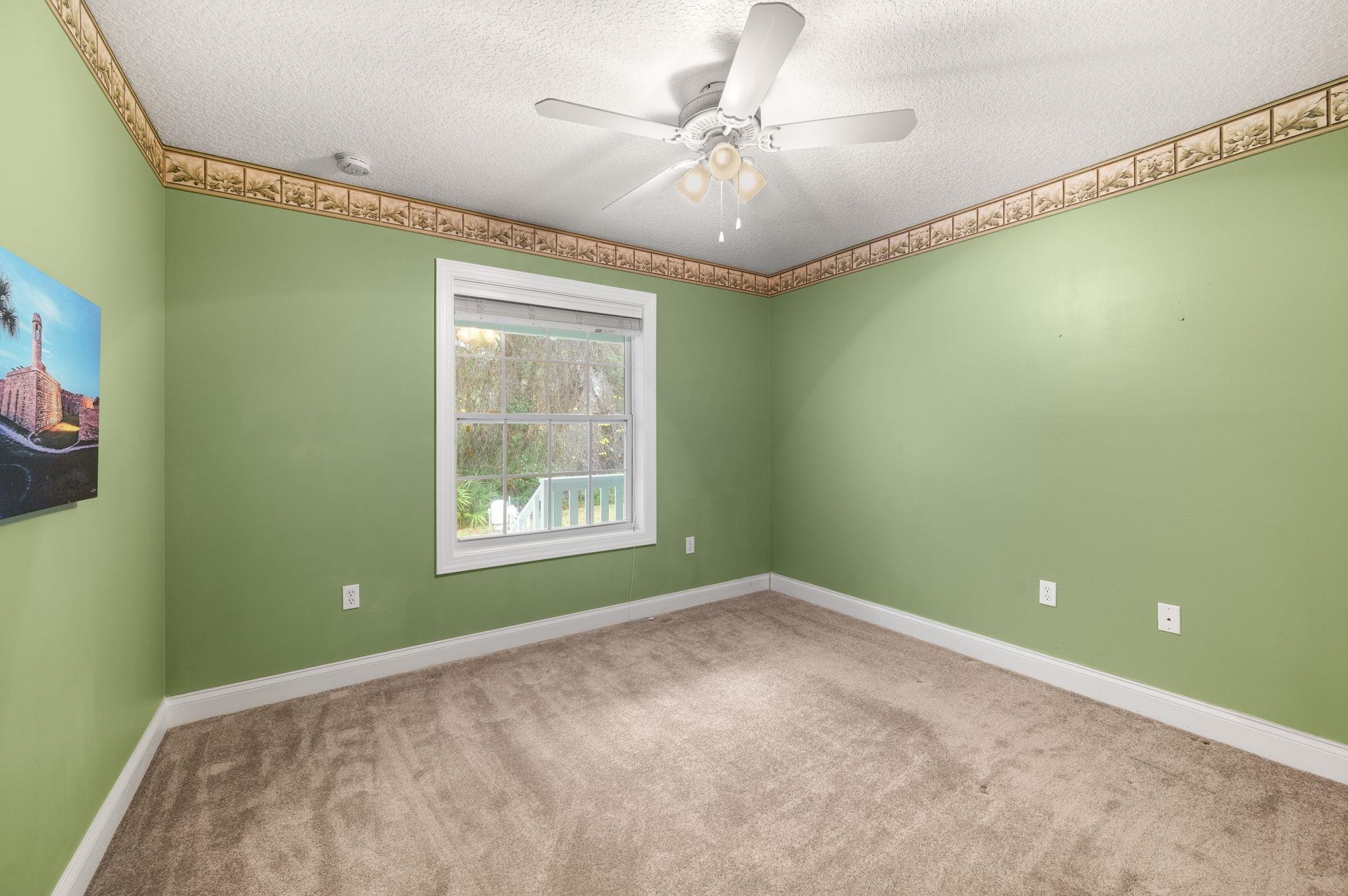 3489 Kings Road St. Augustine, FL 32086 - Photo 32 of 76 a view of a big room with windows