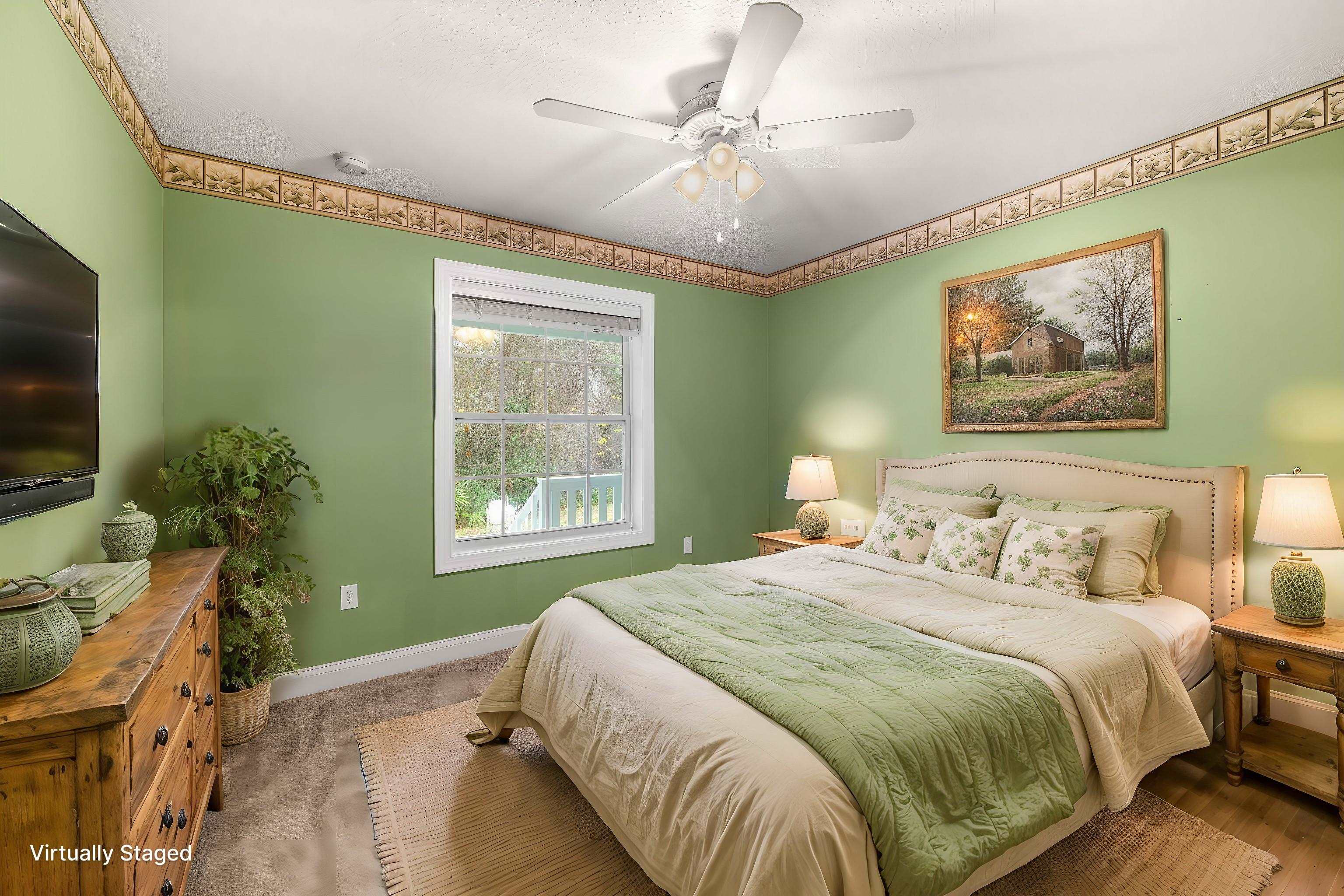 3489 Kings Road St. Augustine, FL 32086 - Photo 33 of 76 a spacious bedroom with a bed and a painting on the wall