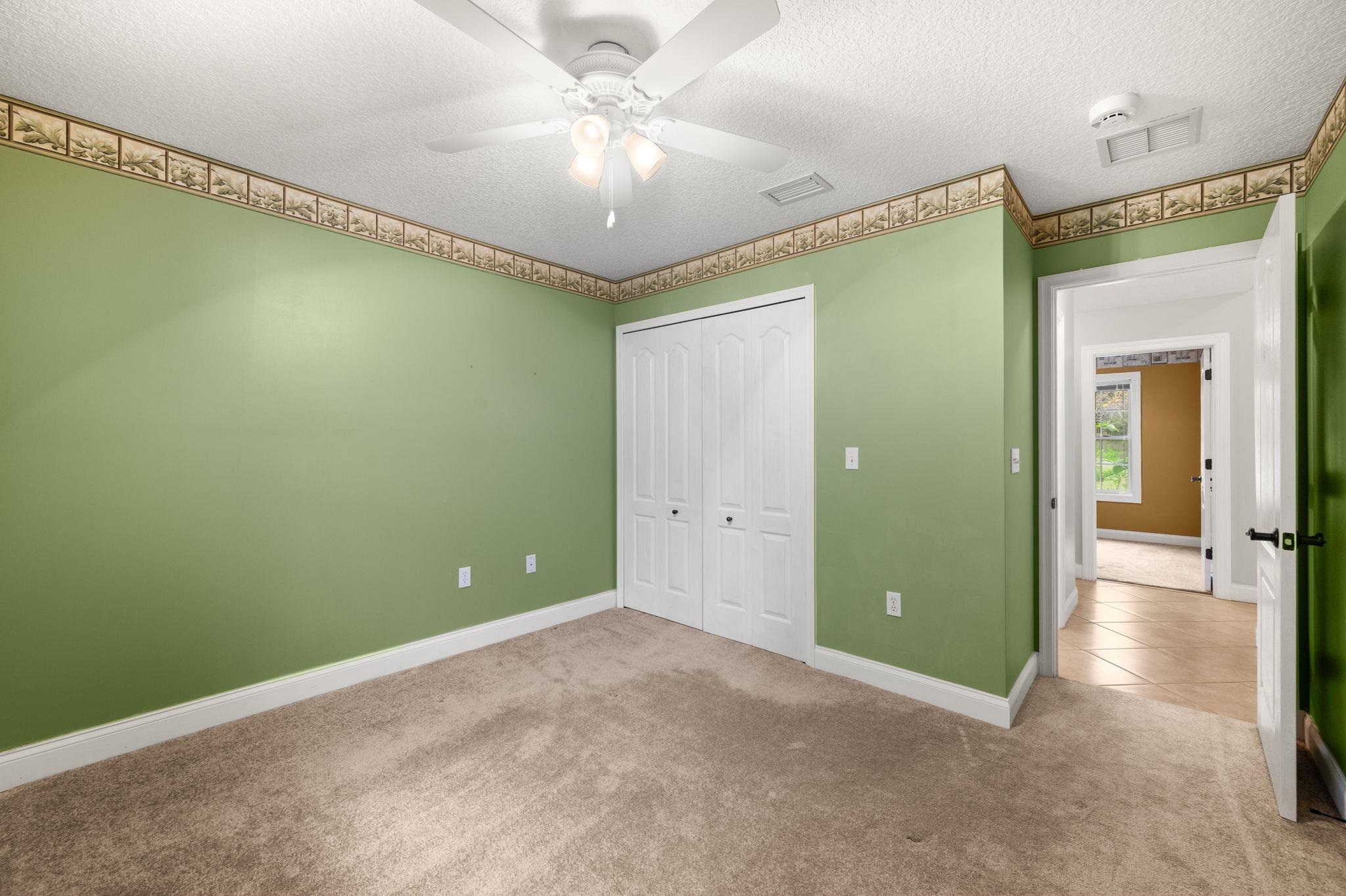 3489 Kings Road St. Augustine, FL 32086 - Photo 34 of 76 a view of a room with a chandelier fan and a large window