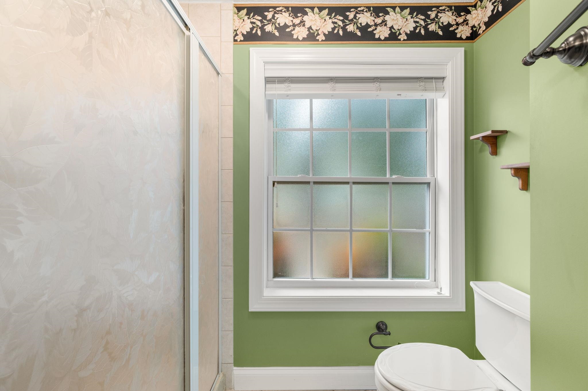 3489 Kings Road St. Augustine, FL 32086 - Photo 39 of 76 a bathroom with a toilet sink and mirror